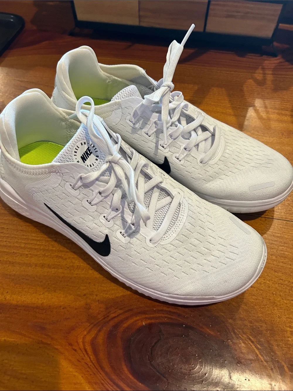 Nike Women’s White Athletic Running Shoes with Black Swoosh